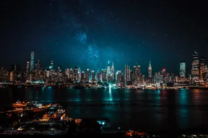 Starry Sky Skyscraper City At Night Wallpaper