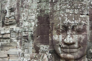 Statue Of A Face In Angkor War, Cambodia Desktop Wallpaper