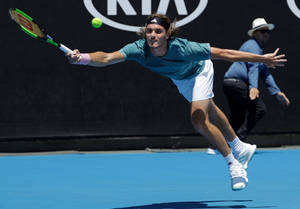 Stefanos Tsitsipas About To Catch The Ball Wallpaper