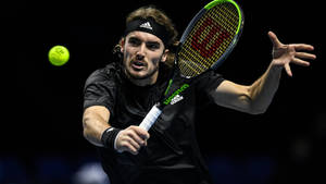 Stefanos Tsitsipas Action-packed Sports Photograph Wallpaper