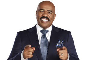Steve Harvey Pointing With A Smile Wallpaper