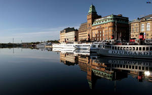 Stockholm Buildings Reflecting On Water Wallpaper