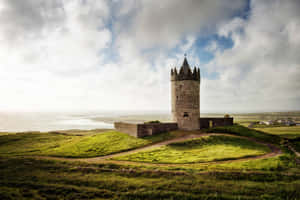 Stone Tower In Green Hill Ireland Desktop Wallpaper