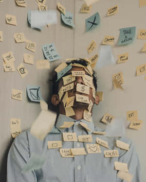 Stress Man Covered In Sticky Notes Wallpaper