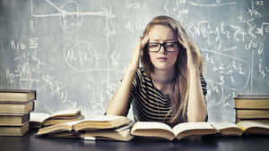 Stressed Student Studying Hard.jpg Wallpaper