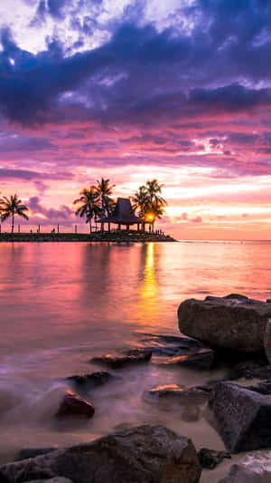 Stroll Along The Sandy Beach With Sunset At Its Best Wallpaper
