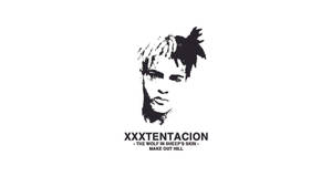Strong Portrait Of Xx Tentacion In Black And White Wallpaper