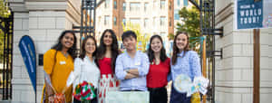 Students Smiling At George Washington University Gate Wallpaper