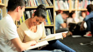 Students Studying Togetherin Library.jpg Wallpaper