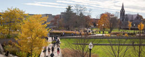 Students Walking On A Pathway At University Of Massachusetts Wallpaper