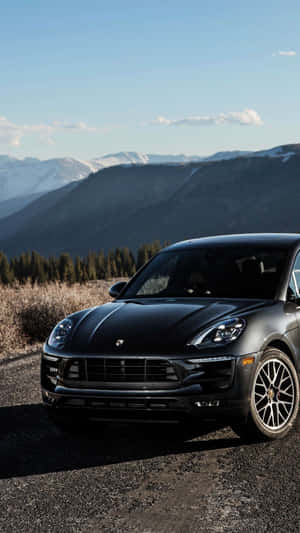 Stunning Black Porsche On City Street Wallpaper
