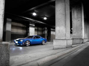 Stunning Blue Dodge Challenger Srt Standing In All Its Glory Wallpaper