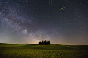 Stunning Comet Streaking Across The Night Sky Wallpaper