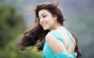 Stunning Hd Image Of Actress Kajal Agarwal With Flowing Hair Wallpaper