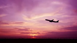 Stunning Pink Airplane Gliding Through The Sky Wallpaper