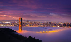 Stunning View Of Foggy San Francisco Skyline Wallpaper
