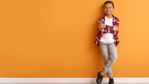 Stylish Boy On Orange Background Wallpaper