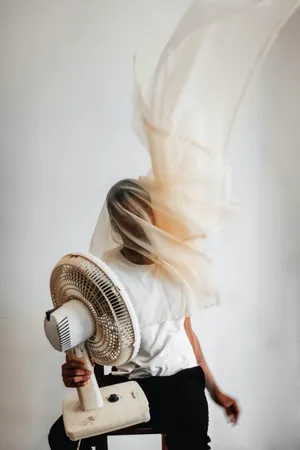 Stylish Man Holding A Fan Wallpaper