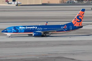 Sun Country Airlines Aircraft On Airport Tarmac Wallpaper