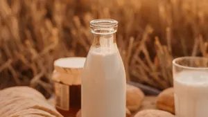 Sundown Picnic With Milk Bottle And Glass Wallpaper