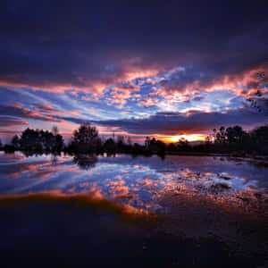 Sunset Reflected In A Lake Wallpaper