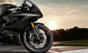 Superb Yamaha Motorcycle Zooming On Open Road Wallpaper