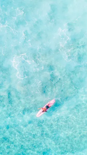 Surfing In Baby Blue Sea Wallpaper
