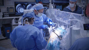 Surgeon In Experimental Brain Surgery Wallpaper