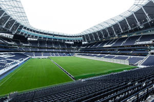 Sweeping View Of Tottenham Hotspur's Majestic Stadium Wallpaper