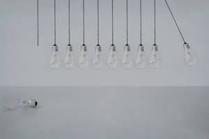 Swinging Transparent Light Bulbs Wallpaper