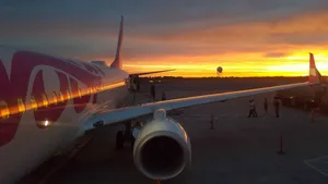 Swoop Airlines Jet Engine Illuminating The Skies Wallpaper
