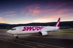 Swoop Airlines Plane At Runway Wallpaper