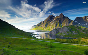 Take In The Breathtaking Views Of Majestic Mountains In This Scenic Landscape. Wallpaper