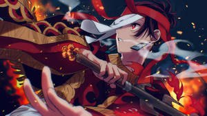 Tanjiro Kamado In Vibrant Red Kimono With A Determined Look Wallpaper