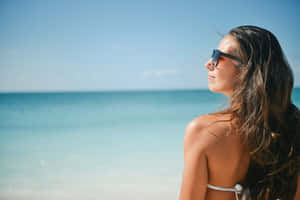 Tanned Brunette Girl On Beach Wallpaper