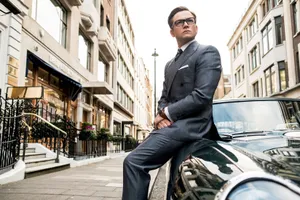 Taron Egerton In Kingsman: The Secret Service – Suited For Action Wallpaper