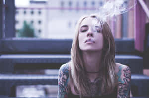 Tattooed Girl Smoking Outside Wallpaper