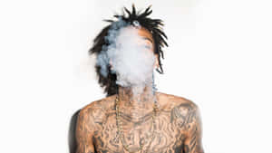 Tattooed Man Exhaling Smoke Wallpaper