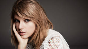 Taylor Swift In Her Signature Whimsical Style. Wallpaper