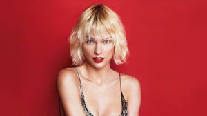 Taylor Swift Radiates Beauty And Confidence In A Fiery Red Dress Wallpaper