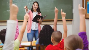 Teacher Class Recitation Students Raising Hands Wallpaper
