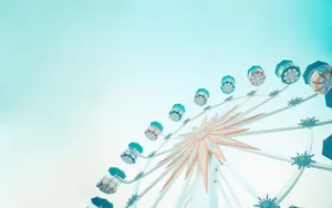 Teal Ferris Wheel Against Bright Sky Wallpaper
