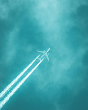Teal Sky And Airplane Wallpaper