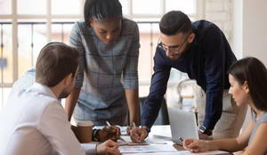 Team Brainstorming For Project Initiative Wallpaper