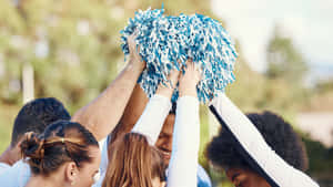 Team Cheer Huddlewith Pom Poms Wallpaper