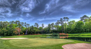 Tee Off And Enjoy A Round Of Golf With A View Of Nature Wallpaper