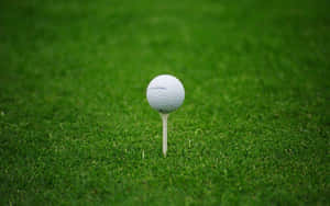 Tee Off On The Green To Enjoy An Awesome Golf Experience Wallpaper