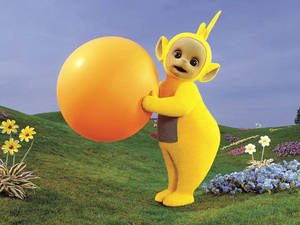 Teletubbies Laa-laa Holding A Ball Wallpaper