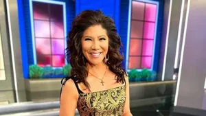 Television Host Smiling On Set.jpg Wallpaper