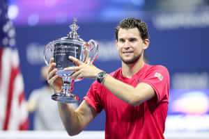 Tennis Champion Holding Trophy Wallpaper